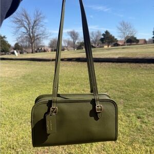 Coach Swing Zip Buckle Detail Satchel Bag in the color Oliver